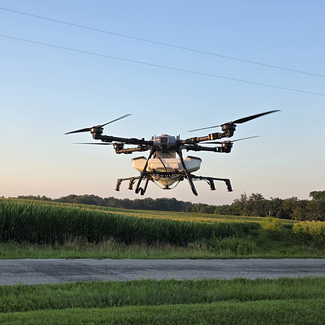 Elevon Aerial Ag Z80 spray drone flying by crops